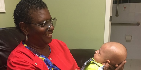 Nurse Jackie holding baby